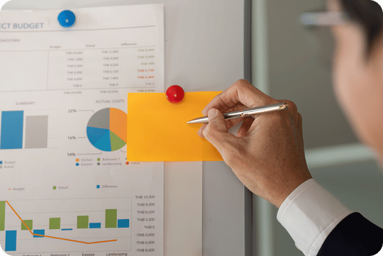 Business owner reviewing financial tracking dashboard for a meal prep company